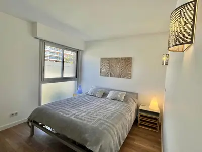 a bedroom with a bed and a window at Mimosas by Welcome to Cannes in Cannes