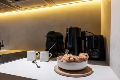 a bowl of food sitting on a counter next to a coffee maker at WABISABI SUITES - MÉRO in Cannes