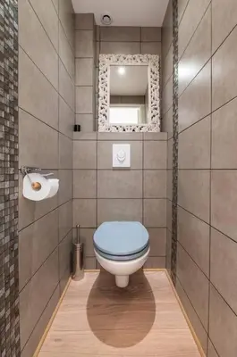 a bathroom with a blue toilet and a mirror at 3 VIDAL - Splendide appartement 4 couchage hyper centre de Cannes in Cannes