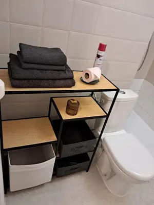 a bathroom with a toilet and a table with a towel at Studio 6minutes Croisette cannes in Cannes