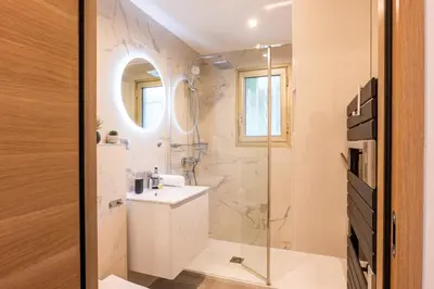 a bathroom with a sink and a shower at RARE ! Studio with terrace 5min walk to the Palais in Cannes