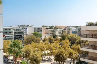 an aerial view of a city with buildings at Cannes Palm Beach Parking, clim, wifi plage 2' à pieds in Cannes