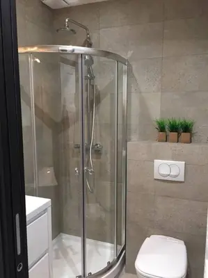 a shower stall in a bathroom with a toilet at Mythique Miramar Cannes Croisette Terrasse Clim Parking Wifi in Cannes