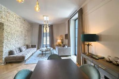 a living room with a couch and a table at Marvellous 5 bed Cannes Centre in Cannes