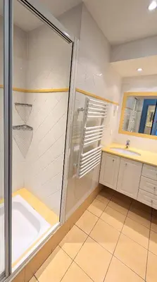a bathroom with a shower and a sink and a tub at Ref BELLAMARE in Cannes
