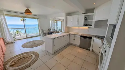 a large kitchen with a view of the ocean at Ref BELLAMARE in Cannes