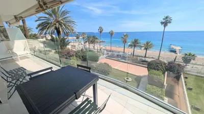 a balcony with a view of the beach and the ocean at Ref BELLAMARE in Cannes