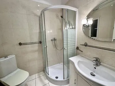 a bathroom with a shower and a toilet and a sink at Cannes La Croisette - PALAIS MIRAMAR - Studio au calme coté jardin in Cannes