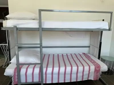 a couple of bunk beds in a room at Toit terrasse dans résidence avec piscine in Cannes