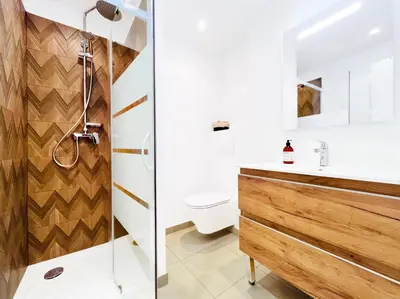 a bathroom with a shower and a sink at L’Iris - Suquet Cannes Centre in Cannes