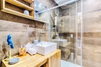 a bathroom with a sink and a shower at L'Étrier-Cannes Centre Terrasse in Cannes
