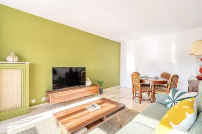 a living room with a couch and a table at L'Étrier-Cannes Centre Terrasse in Cannes