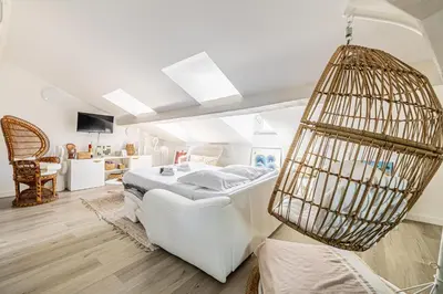 a room with a bed and a bird cage at WELCOME - Stunning 2-bedroom at 5 minutes from Palais des Festivals in Cannes
