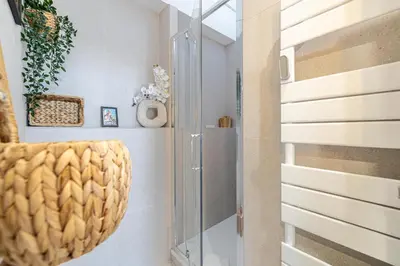 a glass door in a hallway with a plant at WELCOME - Stunning 2-bedroom at 5 minutes from Palais des Festivals in Cannes