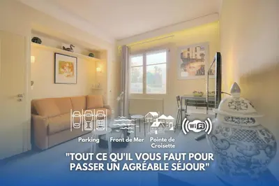 a living room with a couch and a table at Le Ed- Croisette - Parking - VCA in Cannes