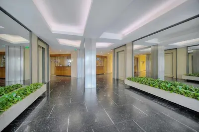a hallway with plants in the middle of a building at Le Ed- Croisette - Parking - VCA in Cannes
