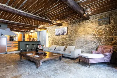 a living room with a couch and a table at Triplex 150m2 coeur vieille ville in Cannes