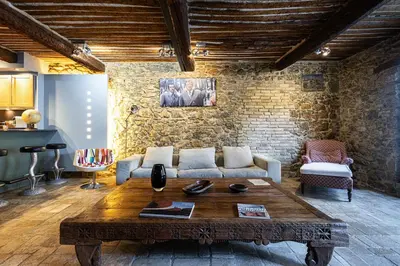 a living room with a couch and a table at Triplex 150m2 coeur vieille ville in Cannes