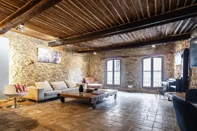 a living room with a couch and a table at Triplex 150m2 coeur vieille ville in Cannes