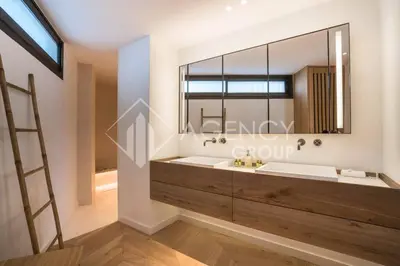 a bathroom with two sinks and a large mirror at Superbe Appartement, Croisette in Cannes