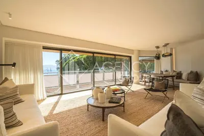 a living room with a couch and a table at Superbe Appartement, Croisette in Cannes
