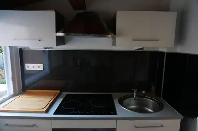 a small kitchen with a sink and a stove at Grand studio de 30m2 !central !spacieux !différent ! in Cannes