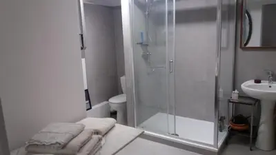 a bathroom with a shower and a sink at Grand studio de 30m2 !central !spacieux !différent ! in Cannes