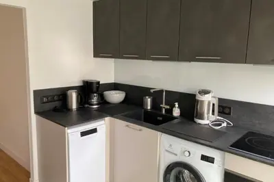 a kitchen with a washer and a washing machine at Beautiful family cocoon of 65 m close to the sea in Cannes