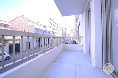 a balcony of a building with a view of a street at Appartement Céto Superb and luminous apartment in Cannes