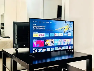 a flat screen tv sitting on top of a table at Palm Croisette - Studio vue Mer & Martinez in Cannes