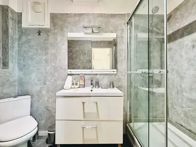 a bathroom with a toilet and a sink and a shower at Palm Croisette - Studio vue Mer & Martinez in Cannes
