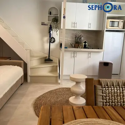 a living room with a bed and a staircase at VILLA SEPHORA CANNES in Cannes