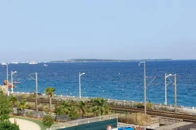 a view of the ocean with a train track at Bocca Baie T2 en bord de mer - Axelle Loc Appart in Cannes