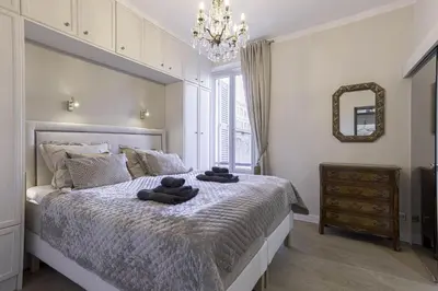 a bedroom with a bed with two towels on it at Appartement De Luxe, Meynadier by Halldis in Cannes