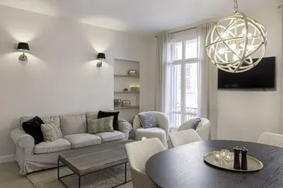 a living room with a couch and a table at Appartement De Luxe, Meynadier by Halldis in Cannes