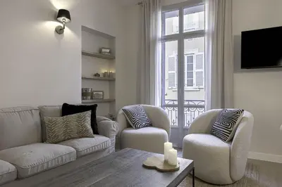a living room with a couch and two chairs and a window at Appartement De Luxe, Meynadier by Halldis in Cannes