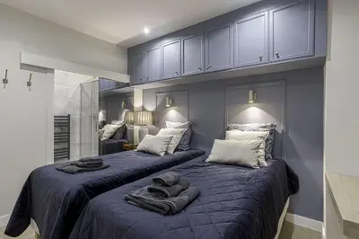 two beds in a bedroom with blue walls at Appartement De Luxe, Meynadier by Halldis in Cannes