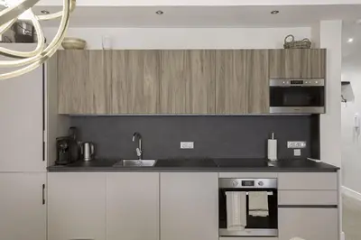 a kitchen with a sink and a microwave at Appartement De Luxe, Meynadier by Halldis in Cannes