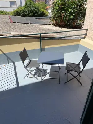a table and two chairs sitting on a patio at NEGRIN in Cannes