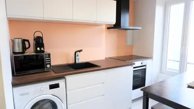 a kitchen with a washing machine and a microwave at Proche Palais Des Festivals,Croisette - Hyper centre - Palmazur Vacances in Cannes
