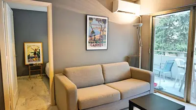 a living room with a couch and a table at Proche Croisette, T2 avec terrasse, By Palmazur in Cannes