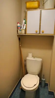 a bathroom with a toilet with a shelf above it at Proche Croisette, T2 avec terrasse, By Palmazur in Cannes