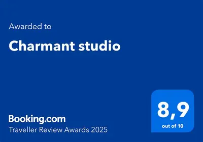 a blue sign with the text awarded tochamant studio at Charmant studio in Cannes