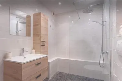 a bathroom with a shower and a sink and a tub at appartement Carré d’or 2 pas de la croisette in Cannes