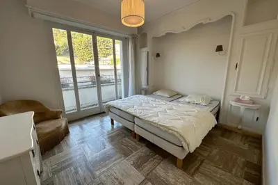 a bedroom with a bed and a large window at WE CANNES ! Amazing Sea View 2 Bedrooms La Vista in Cannes