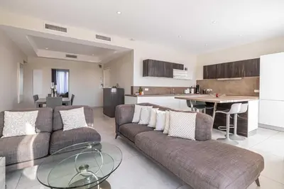 a living room with a couch and a table at Splendid apartment, Sea view, Parking - Croisette in Cannes