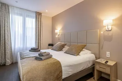 a bedroom with two beds with towels on them at Splendid apartment, Sea view, Parking - Croisette in Cannes