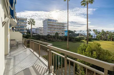 a balcony of a building with palm trees at Splendid apartment, Sea view, Parking - Croisette in Cannes