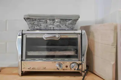 a toaster oven with a basket on top of it at Cannes Bliss - 12mn à pied du Palais, 5mn plages, clim, terrasse in Cannes