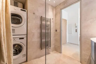 a laundry room with a washer and dryer at Wow this view! 2BR facing Old Port 4th floor Olam Properties in Cannes